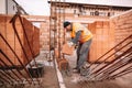 Industrial worker, bricklayer and mason working with bricks Royalty Free Stock Photo