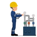 An industrial worker is checking the pressure in the piping system