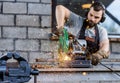 Industrial worker cutting metal