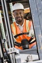 Industrial Worker Driving Forklift At Workplace Royalty Free Stock Photo