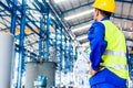 Industrial worker in factory with tools