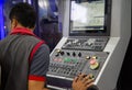 Industrial technician operate CNC milling machine