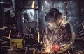 Industrial Worker laborer at the factory welding steel