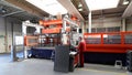 Industrial worker operates a laser cutting machine - employee in a metalworking company Royalty Free Stock Photo