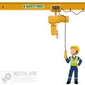 An industrial worker is operating electric chain hoist