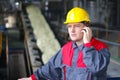 Industrial worker talking on cell phone