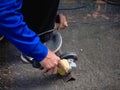 Industrial Worker Using Angle Grinder and Cutting a Metal Royalty Free Stock Photo