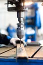 Industrial worker using a mechanical drill machine