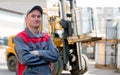 Portrait industrial worker on warehouse forklift truck background Royalty Free Stock Photo