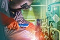 Industrial worker welding in factory closeup with spark light.. Royalty Free Stock Photo