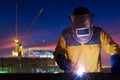 Industrial worker welding steel structure for infrastructure building project Royalty Free Stock Photo