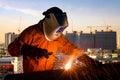 Industrial worker welding steel structure for infrastructure building project Royalty Free Stock Photo