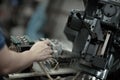 Industrial worker is working on metal work factory process