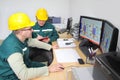 Industrial workers in a control room Royalty Free Stock Photo