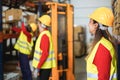 Industrial workers loading delivery boxes inside warehouse store - Focus on woman head Royalty Free Stock Photo
