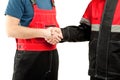 Industrial workers in uniform shake hands