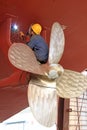 Industrial workers welding ship propeller