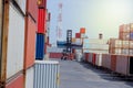 Industrial yard for Logistic Import Export business. Forklifts handling containers. shipping container Logistics yard with product Royalty Free Stock Photo