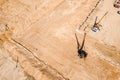 Yellow truck crane and pile drilling machine working at city construction site. aerial view Royalty Free Stock Photo