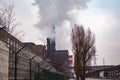 Industrial zone. Air pollution by smoke coming out of two factory chimneys. Royalty Free Stock Photo