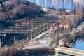 Industrial zone and railway of a city near a river with building equipment Royalty Free Stock Photo