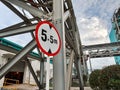 Industrial zone showing 5.5m height restriction on piping structure Royalty Free Stock Photo