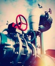 Industrial Steel pipelines and valves against blue sky Royalty Free Stock Photo