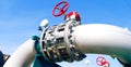 Industrial zone pipelines and valves against blue sky Royalty Free Stock Photo