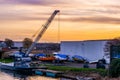 Industrial zone with water and boats at sunset, the harbor of Alphen aan den Rijn, The Netherlands