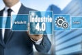 Industrie 4.0 in german industry touchscreen is operated by businessman background
