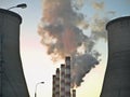 Fuming industrial tubes chimneys Royalty Free Stock Photo