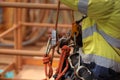 Industry abseiler worker working at height abseiling removing rope from chest harness croll safety device Royalty Free Stock Photo