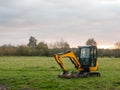 Industry construction environment yellow digger machine parked o Royalty Free Stock Photo