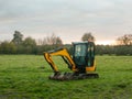 Industry construction environment yellow digger machine parked o Royalty Free Stock Photo