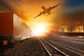 industry container trainst running on railways track and commercial ship in port ,plane air cargo flying above use for land Royalty Free Stock Photo