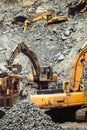 Industry details - open pit ore mine. Close up details of industrial excavator working on site