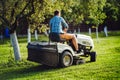 Industry details - portrait of gardener smiling and mowing lawn