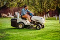 Industry details - portrait of gardener smiling and mowing lawn