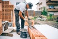 industry details - Worker mason building exterior brick walls