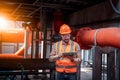 Industry engineer under checking the industry cooling tower air conditioner is water cooling tower air chiller HVAC of large indus Royalty Free Stock Photo