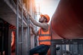 Industry engineer under checking the industry cooling tower air conditioner is water cooling tower air chiller HVAC of large indus Royalty Free Stock Photo