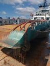 Industry view - Ocean Vessel in the dry dock in shipyard. Old rusty ship under repair Royalty Free Stock Photo