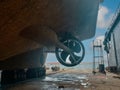 Industry view - Ocean Vessel in the dry dock in shipyard. Old rusty ship under repair Royalty Free Stock Photo