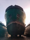 Industry view - Ocean Vessel in the dry dock in shipyard. Old rusty ship under repair Royalty Free Stock Photo