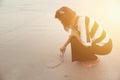 Indy women alone draw heart shape on the beach