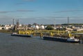 INEOS pier with tanker barges and Exxonmobil plant, Antwerpen, Belgium