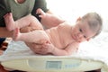 Infant baby been examined on the balance Royalty Free Stock Photo