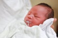 Infant baby is belching after eating milk Royalty Free Stock Photo