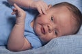 Infant baby boy on a blue blanket Royalty Free Stock Photo