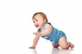 Infant child baby boy crawling and happy looking, isolated on a white background. Royalty Free Stock Photo